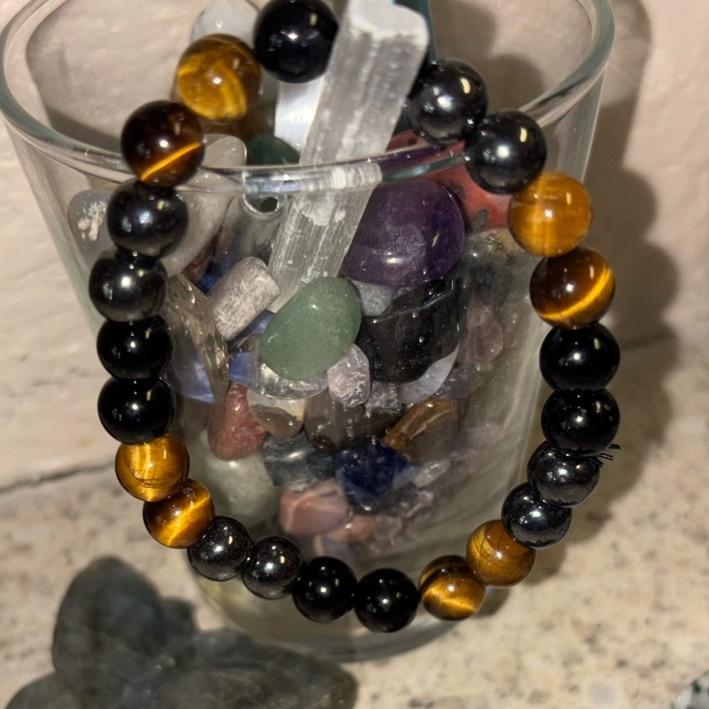 Protective crystal bracelet in one.Hematite,Tiger’s Eye & silver Obsidian in one